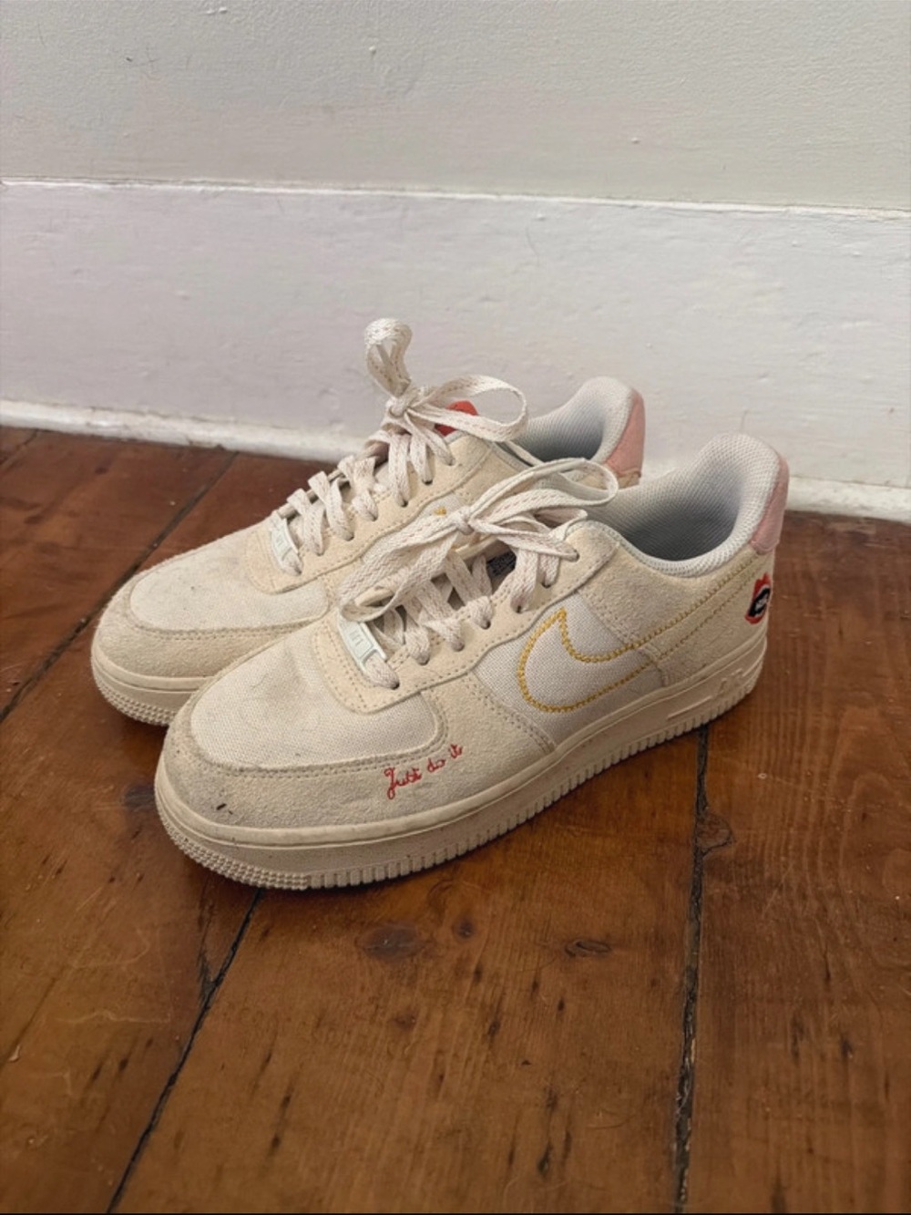 Nike Cream Low-Top Sneakers with Pink Heel and Yellow Swoosh